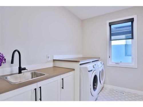 114 Rock Lake Heights Nw, Calgary, AB - Indoor Photo Showing Laundry Room