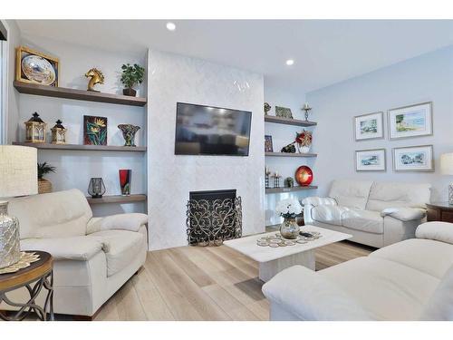 114 Rock Lake Heights Nw, Calgary, AB - Indoor Photo Showing Living Room With Fireplace