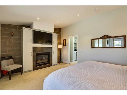 37 28 Avenue Sw, Calgary, AB - Indoor Photo Showing Bedroom With Fireplace