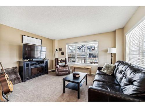 234 Silverado Plains Close Sw, Calgary, AB - Indoor Photo Showing Living Room