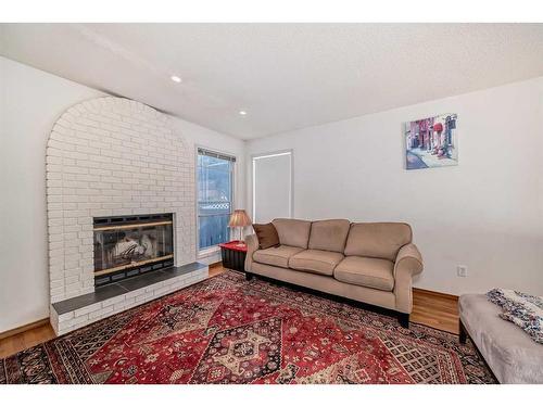 2775 Signal Hill Drive Sw, Calgary, AB - Indoor Photo Showing Living Room With Fireplace