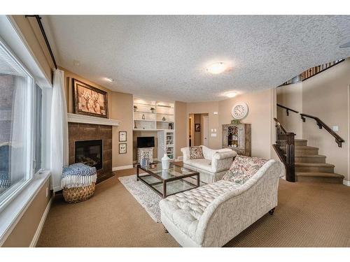 20 Panatella Manor Nw, Calgary, AB - Indoor Photo Showing Living Room With Fireplace