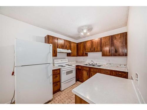 4316 6 Avenue Se, Calgary, AB - Indoor Photo Showing Kitchen With Double Sink