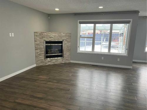 98 Evansbrooke Park Nw, Calgary, AB - Indoor Photo Showing Living Room With Fireplace