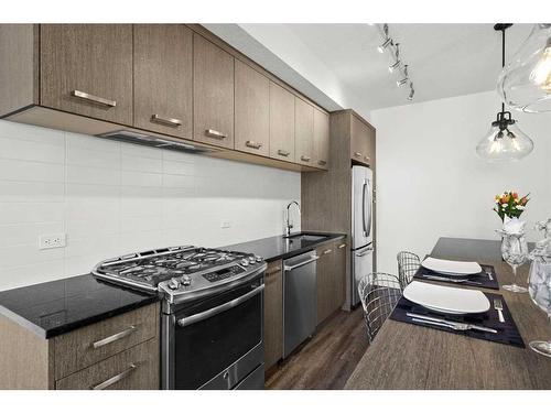 306-811 5 Street Ne, Calgary, AB - Indoor Photo Showing Kitchen With Stainless Steel Kitchen