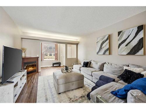 27-43 Springborough Boulevard Sw, Calgary, AB - Indoor Photo Showing Living Room With Fireplace