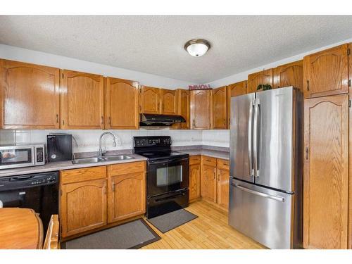 46 Templeby Way Ne, Calgary, AB - Indoor Photo Showing Kitchen With Double Sink
