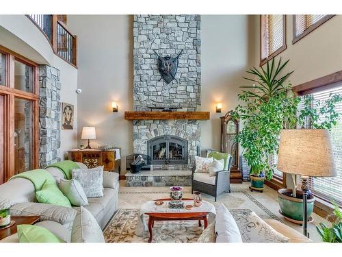 282020 Range Road 43 Road, Rural Rocky View County, AB - Indoor Photo Showing Living Room With Fireplace