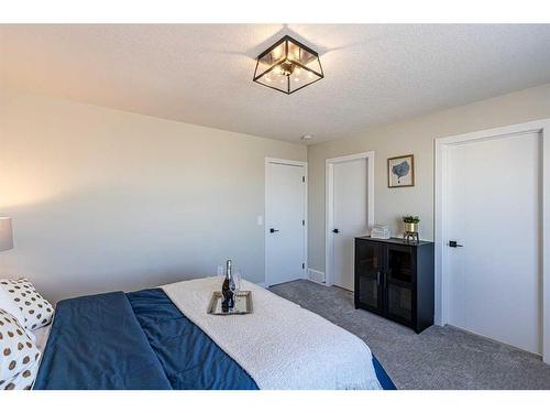 8 Waterford Manor, Chestermere, AB - Indoor Photo Showing Bedroom