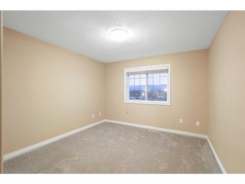 23 Taracove Estate Drive Ne, Calgary, AB - Indoor Photo Showing Other Room