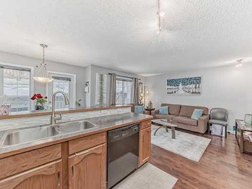 127 Hidden Creek Rise Nw, Calgary, AB - Indoor Photo Showing Kitchen With Double Sink
