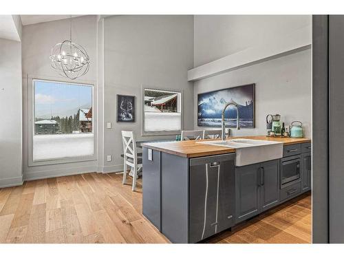 604-3000J Stewart Creek Drive, Canmore, AB - Indoor Photo Showing Kitchen With Double Sink