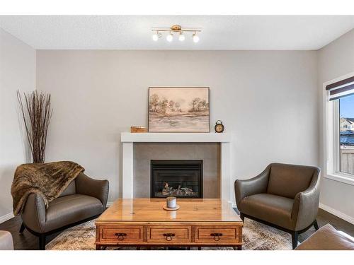 14 Walden Grove Se, Calgary, AB - Indoor Photo Showing Living Room With Fireplace