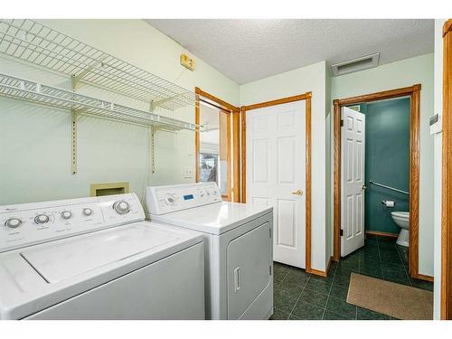 28 Arbour Glen Green Nw, Calgary, AB - Indoor Photo Showing Laundry Room