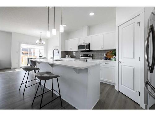 3037 Key Drive Sw, Airdrie, AB - Indoor Photo Showing Kitchen With Upgraded Kitchen