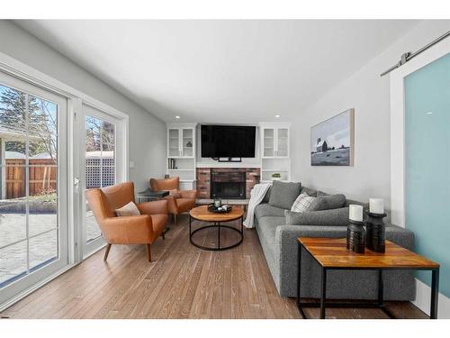 14932 Parkland Boulevard Se, Calgary, AB - Indoor Photo Showing Living Room With Fireplace