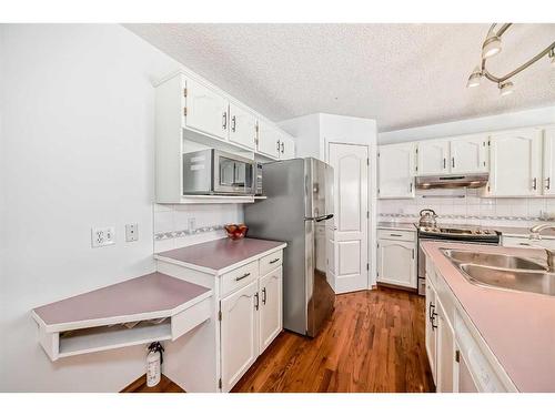 240 Arbour Ridge Way Nw, Calgary, AB - Indoor Photo Showing Kitchen With Double Sink