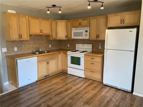 4918 54 Avenue, Olds, AB - Indoor Photo Showing Kitchen With Double Sink