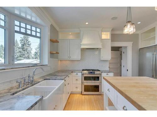 51 White Oak Crescent Sw, Calgary, AB - Indoor Photo Showing Kitchen With Double Sink With Upgraded Kitchen