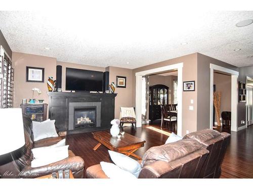253 Tuscany Estates Rise Nw, Calgary, AB - Indoor Photo Showing Living Room With Fireplace
