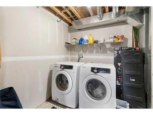 317-10 Auburn Bay Avenue Se, Calgary, AB - Indoor Photo Showing Laundry Room