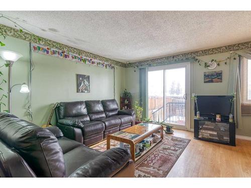 605-350 Falconridge Crescent Ne, Calgary, AB - Indoor Photo Showing Living Room