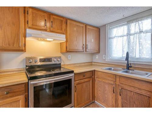 605-350 Falconridge Crescent Ne, Calgary, AB - Indoor Photo Showing Kitchen With Double Sink