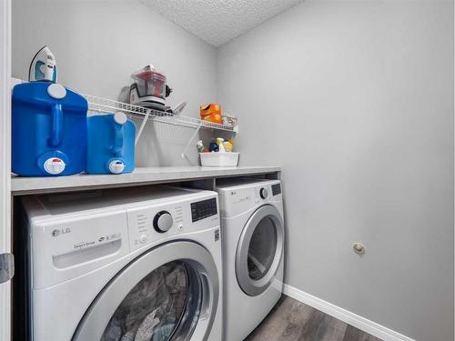 12 Yorkstone Heath Sw, Calgary, AB - Indoor Photo Showing Laundry Room