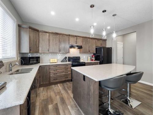 12 Yorkstone Heath Sw, Calgary, AB - Indoor Photo Showing Kitchen With Double Sink