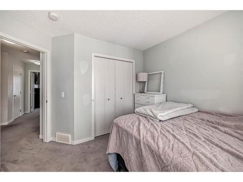 202 New Brighton Walk Se, Calgary, AB - Indoor Photo Showing Bedroom