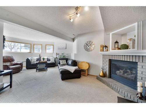 108 Hidden Vale Crescent Nw, Calgary, AB - Indoor Photo Showing Living Room With Fireplace