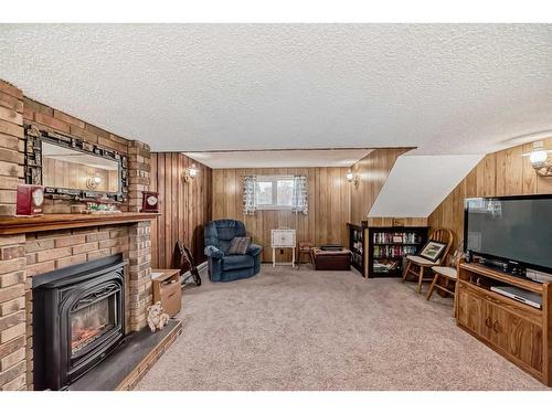 3816 Dover Ridge Drive Se, Calgary, AB - Indoor Photo Showing Living Room With Fireplace