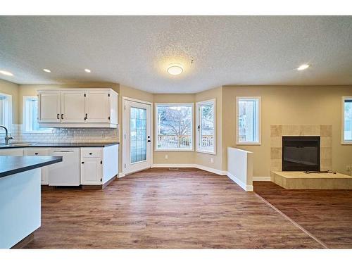 2811 Signal Hill Drive Sw, Calgary, AB - Indoor Photo Showing Kitchen With Fireplace