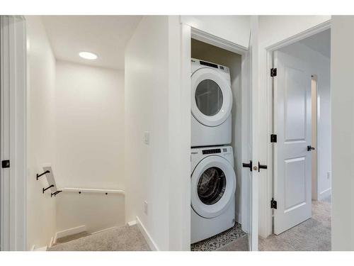 1004-525 River Heights Drive, Cochrane, AB - Indoor Photo Showing Laundry Room