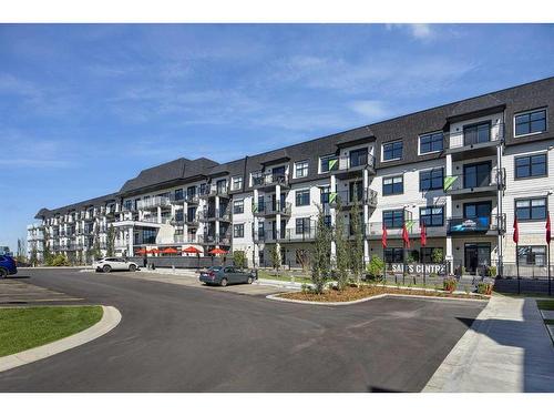 219-255 Les Jardins Park Se, Calgary, AB - Outdoor With Balcony With Facade