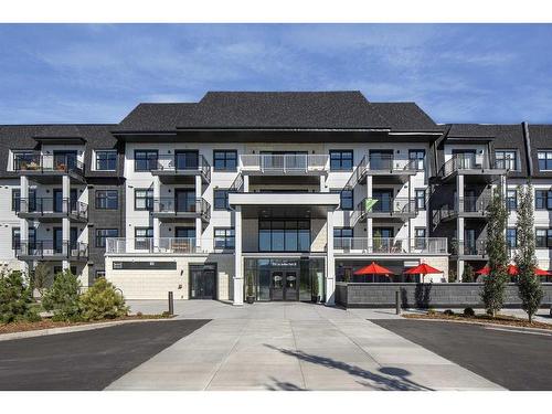 219-255 Les Jardins Park Se, Calgary, AB - Outdoor With Balcony With Facade