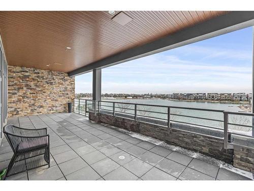 202-29 Mahogany Circle Se, Calgary, AB - Outdoor With Body Of Water With Deck Patio Veranda With View With Exterior