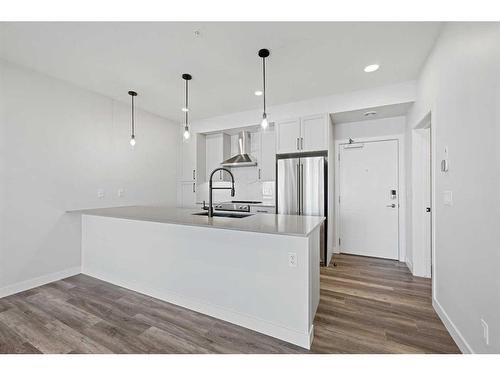 322-255 Les Jardins Park Se, Calgary, AB - Indoor Photo Showing Kitchen With Upgraded Kitchen