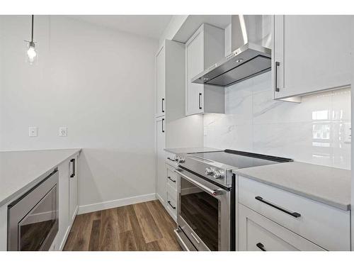 322-255 Les Jardins Park Se, Calgary, AB - Indoor Photo Showing Kitchen With Upgraded Kitchen