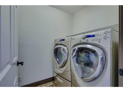 163 Sunset View, Cochrane, AB - Indoor Photo Showing Laundry Room
