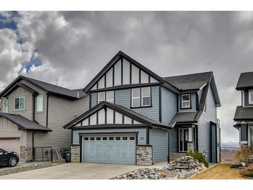 163 Sunset View, Cochrane, AB - Outdoor With Facade