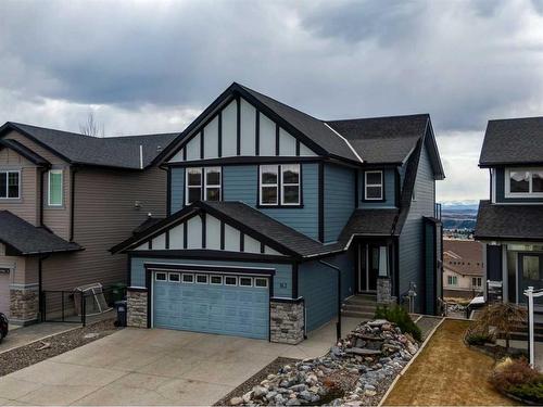 163 Sunset View, Cochrane, AB - Outdoor With Facade