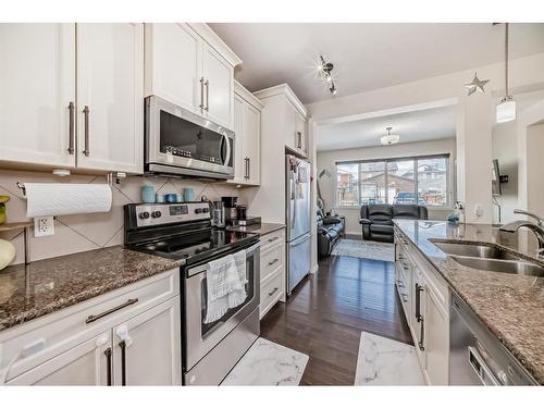 3 Fireside Place, Cochrane, AB - Indoor Photo Showing Kitchen With Double Sink With Upgraded Kitchen