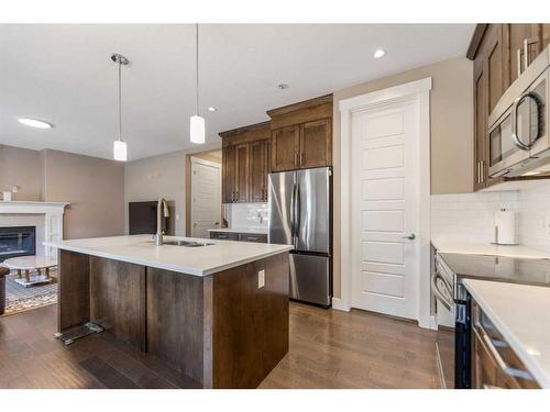 255 Baywater Way Sw, Airdrie, AB - Indoor Photo Showing Kitchen With Stainless Steel Kitchen With Upgraded Kitchen