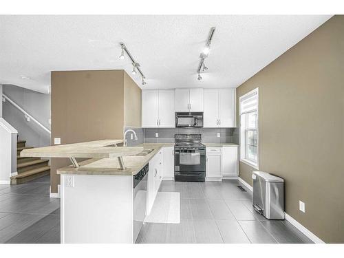 59 New Brighton Common Se, Calgary, AB - Indoor Photo Showing Kitchen With Upgraded Kitchen