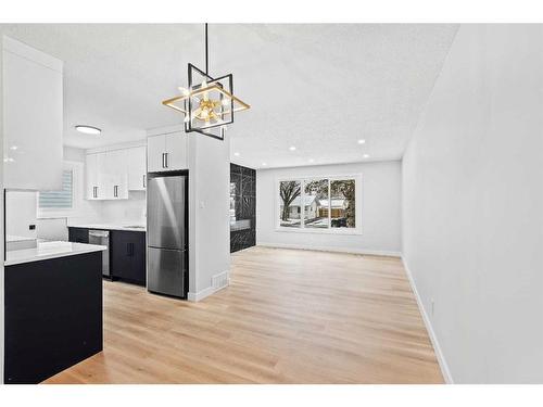 7645 & 7643 21A Street Se, Calgary, AB - Indoor Photo Showing Kitchen