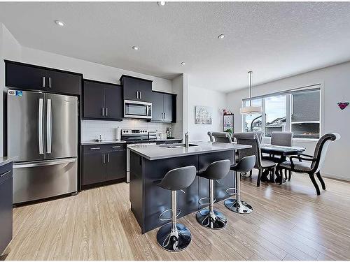 1713 Montgomery Gate Se, High River, AB - Indoor Photo Showing Kitchen With Upgraded Kitchen