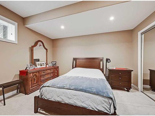 1105 Highland Green View Nw, High River, AB - Indoor Photo Showing Bedroom