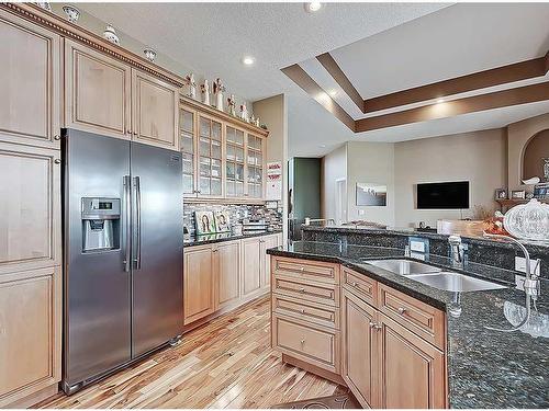 1105 Highland Green View Nw, High River, AB - Indoor Photo Showing Kitchen With Double Sink