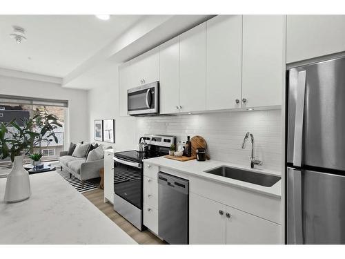 303-455 1 Avenue Ne, Calgary, AB - Indoor Photo Showing Kitchen With Stainless Steel Kitchen With Upgraded Kitchen